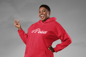 @Peace-hoodie-in-red-by-CP-Designs-Unlimited-worn-by-smiling-young-woman