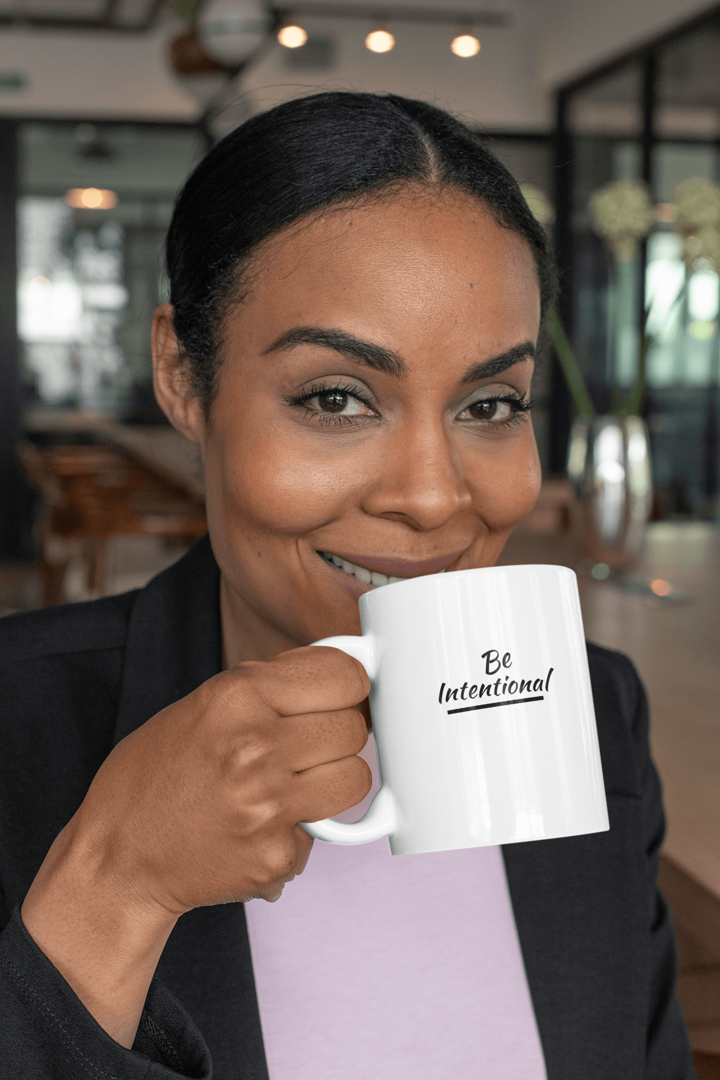 African American woman with Be Intentional Mug by CP Designs Unlimited