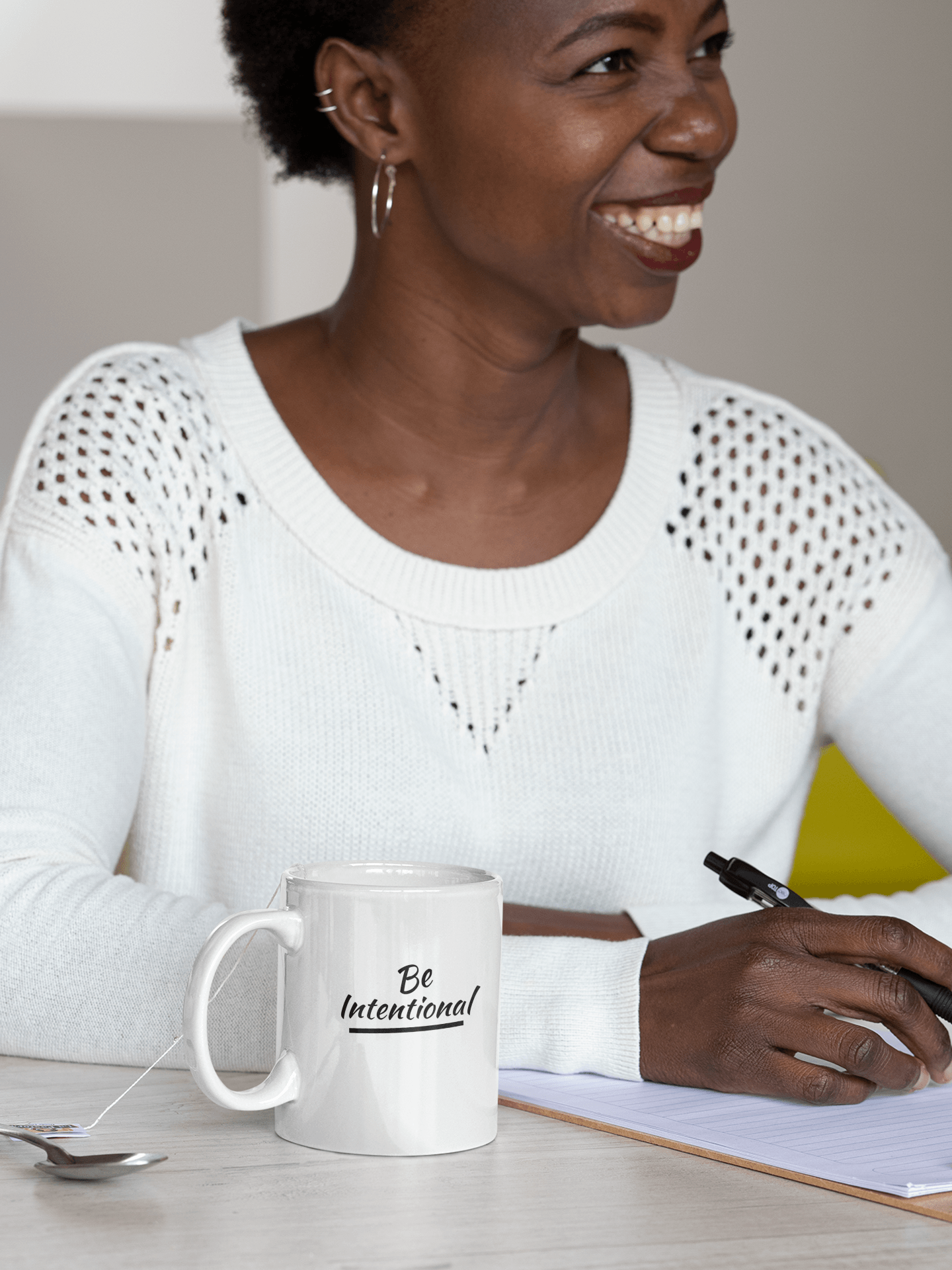 African American woman with Be Intentional Mug by CP Designs Unlimited