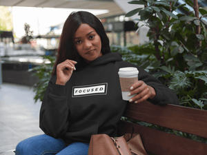 Woman wearing FOCUSED pullover hoodie by CP Designs Unlimited