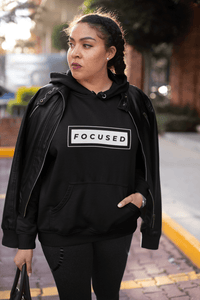 African American woman wearing FOCUSED hoodie by CP Designs Unlimited