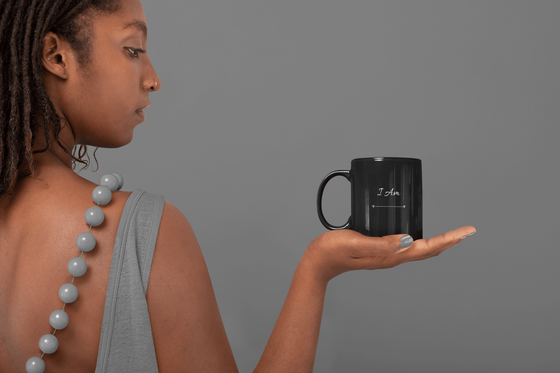African American woman holding I Am Affirmation mug by CP Designs Unlimited