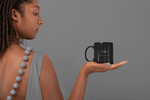 Load image into Gallery viewer, African American woman holding I Am Affirmation mug by CP Designs Unlimited
